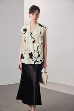 Sleeveless printed V-neck silk blouse