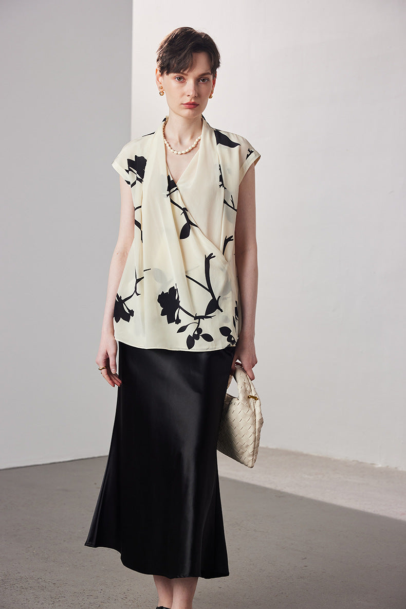 Sleeveless printed V-neck silk blouse