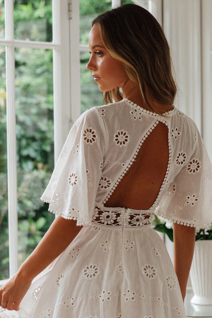 Model wearing white ruffle sleeve A-line dress