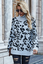 Model wearing animal print high-neck sweater