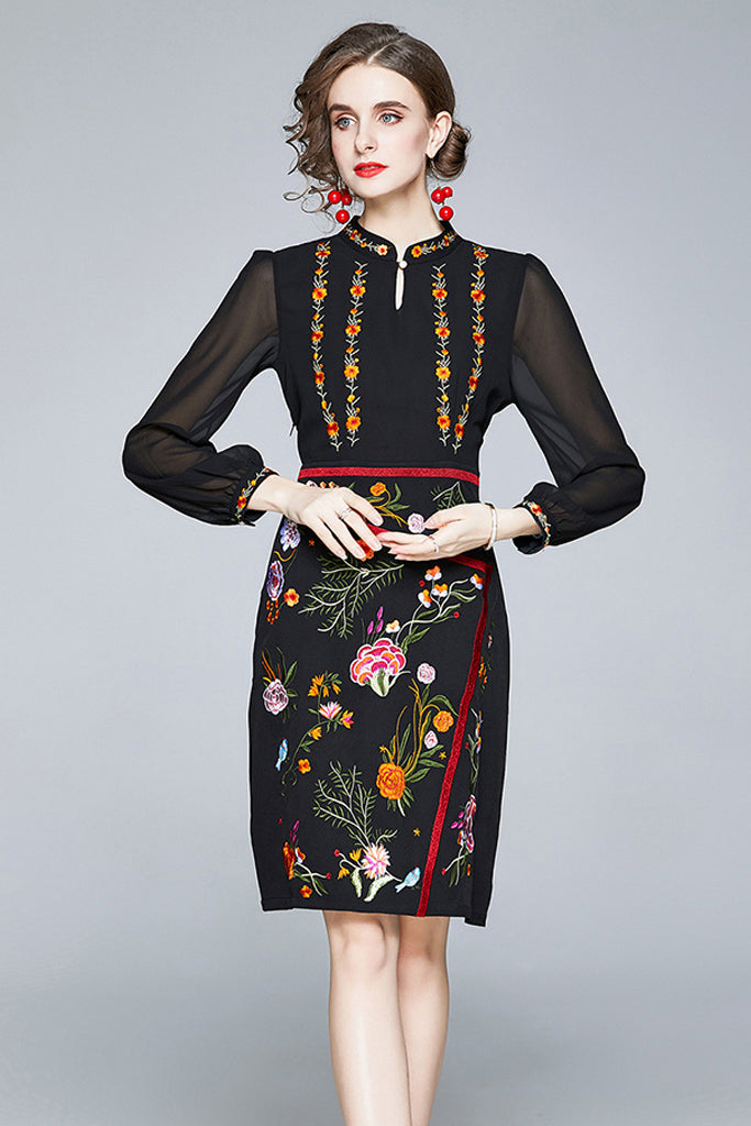 Model wearing embroidered midi dress