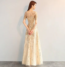 Luxury elegant golden sequined long gown dress
